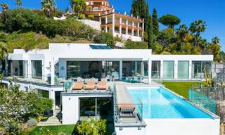 Spacieuse villa architecturale à vendre avec vue spectaculaire sur la mer dans une communauté privée de Benahavis - Marbella 52160 
