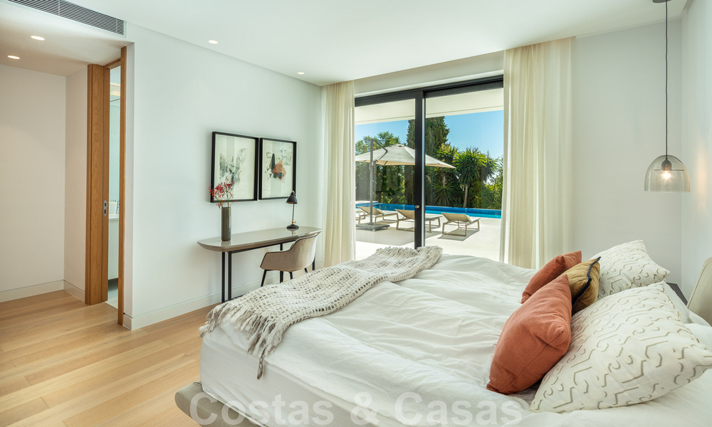 Villa moderne et luxueuse à vendre, avec un court de tennis privé dans un quartier résidentiel prestigieux de la vallée du golf de Nueva Andalucia, Marbella 50142