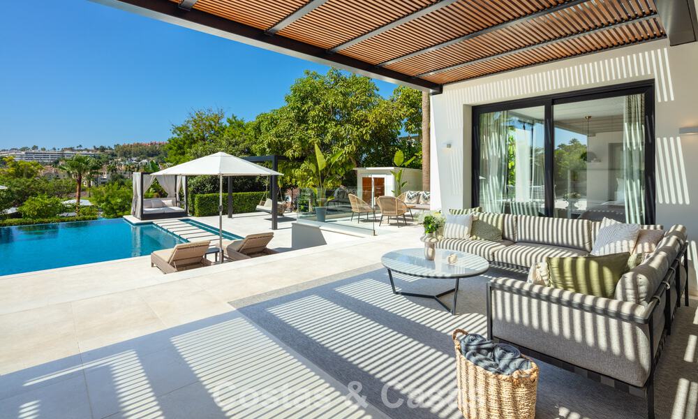 Villa de luxe, moderne et symétrique à vendre à deux pas des terrains de golf de la vallée de Nueva Andalucia, Marbella 56176
