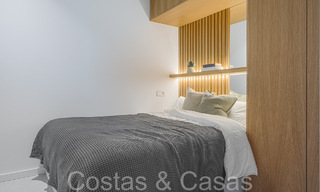 Luxueux appartement à vendre avec terrasse accueillante, piscine privée et vue sur la mer à Nueva Andalucia, Marbella 65195 
